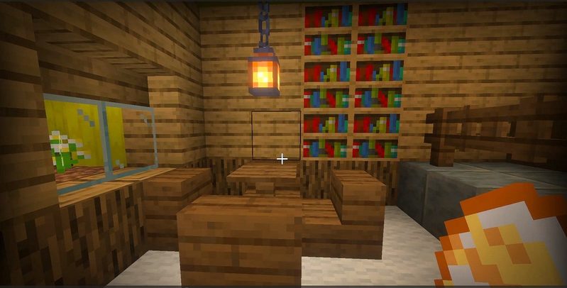 マイクラ統合版BACKROOMS Add-Onの農場奥にある、本棚やテーブル、椅子が設置された部屋