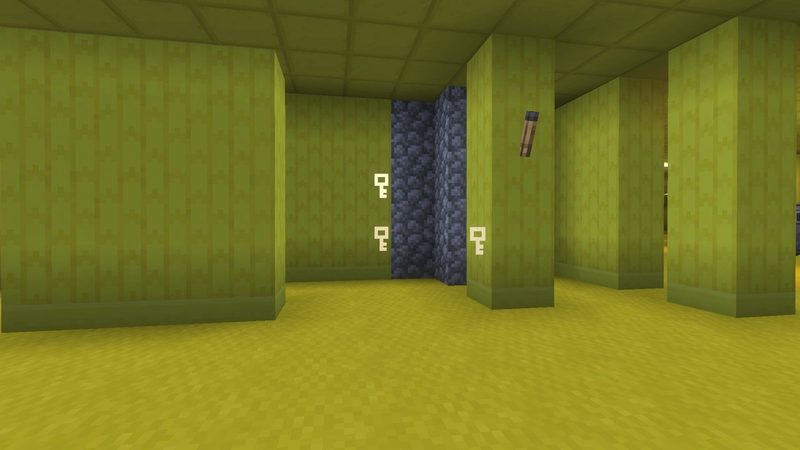 マイクラ統合版BACKROOMS Add-Onで、スペクトルバイザーを装備すると隠し拠点付近の壁に鍵マークが表示された様子